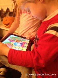 My little man (with oldest hovering!) playing Touch n Sing app